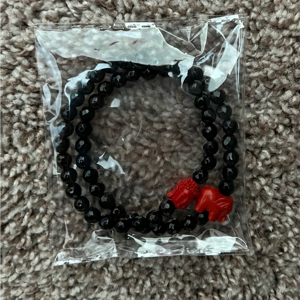 Black Beaded Bracelet with Red Lion Charm